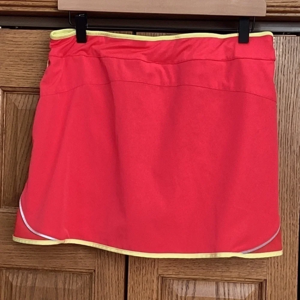 Izod cool-fx golf, tennis, hiking skort. Pink with yellow trim. Women’s size med